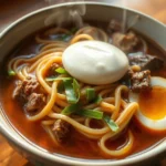New Orleans Yakamein, a flavorful Creole noodle soup with beef, noodles, and egg.